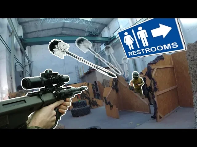guy hits people with toiletbrush at airsoftgame